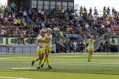 Kristen Parr (15) celebrates her goal with Miranda Schulz (7). Photo Courtesy: goducks.com