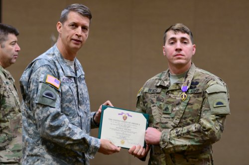 Maj. Gen. Daniel R. Hokanson, Adjutant General, Oregon, awarded the Purple Heart medal to Staff Sgt. Christopher Beach 