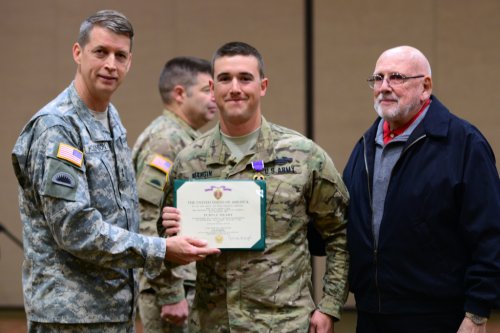 Maj. Gen. Daniel R. Hokanson, Adjutant General, Oregon, awarded the Purple Heart medal to Spc. Michael Mangin