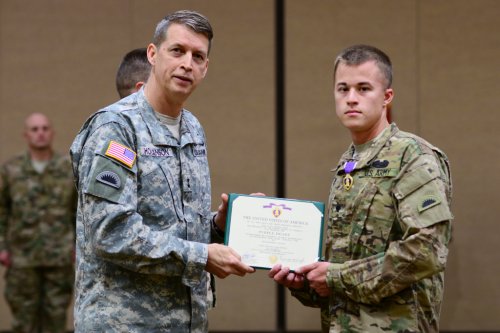Maj. Gen. Daniel R. Hokanson, Adjutant General, Oregon, awarded the Purple Heart medal to Spc. Brian Piccolo