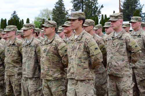 Oregon Army National Guard Soldiers with Charlie Troop, 1st Squadron, 82nd Cavalry Regiment, stand in formation