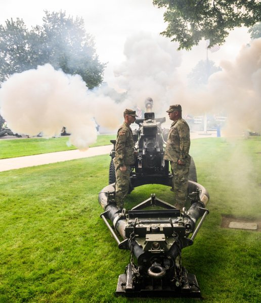 Staff Sgt. Jackson Ryan (left) & Sgt. Paul Marcinuk, assigned to  Bravo Battery 2-218 Field Artillery, Oregon Army National Guard conduct a howitzer salute  during the Memorial Day program held at Beaverton Veterans Memorial Park in Beaverton, Oregon, May 27, 2019