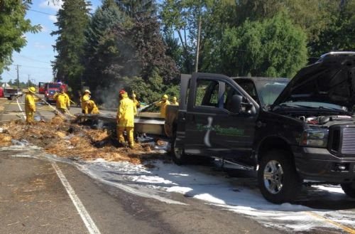 A truck hauling a load of hay has crashed on Hazelgreen Green Road NE near the intersection with Cordon Road NE in Salem. Photo Courtesy: MCFD #1