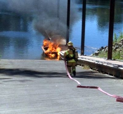 The Keizer Fire District responded to a boat fire Saturday afternoon at the Keizer Rapids Park along the Willamette River, a first in the department's history. Photo Courtesy: Keizer Fire Department